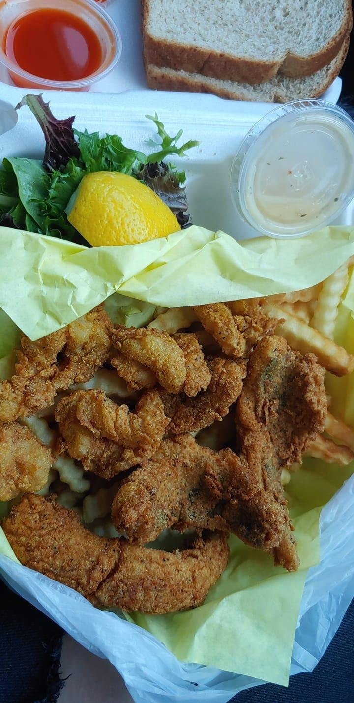 Printed menu showing chicken, fish, and shrimp.