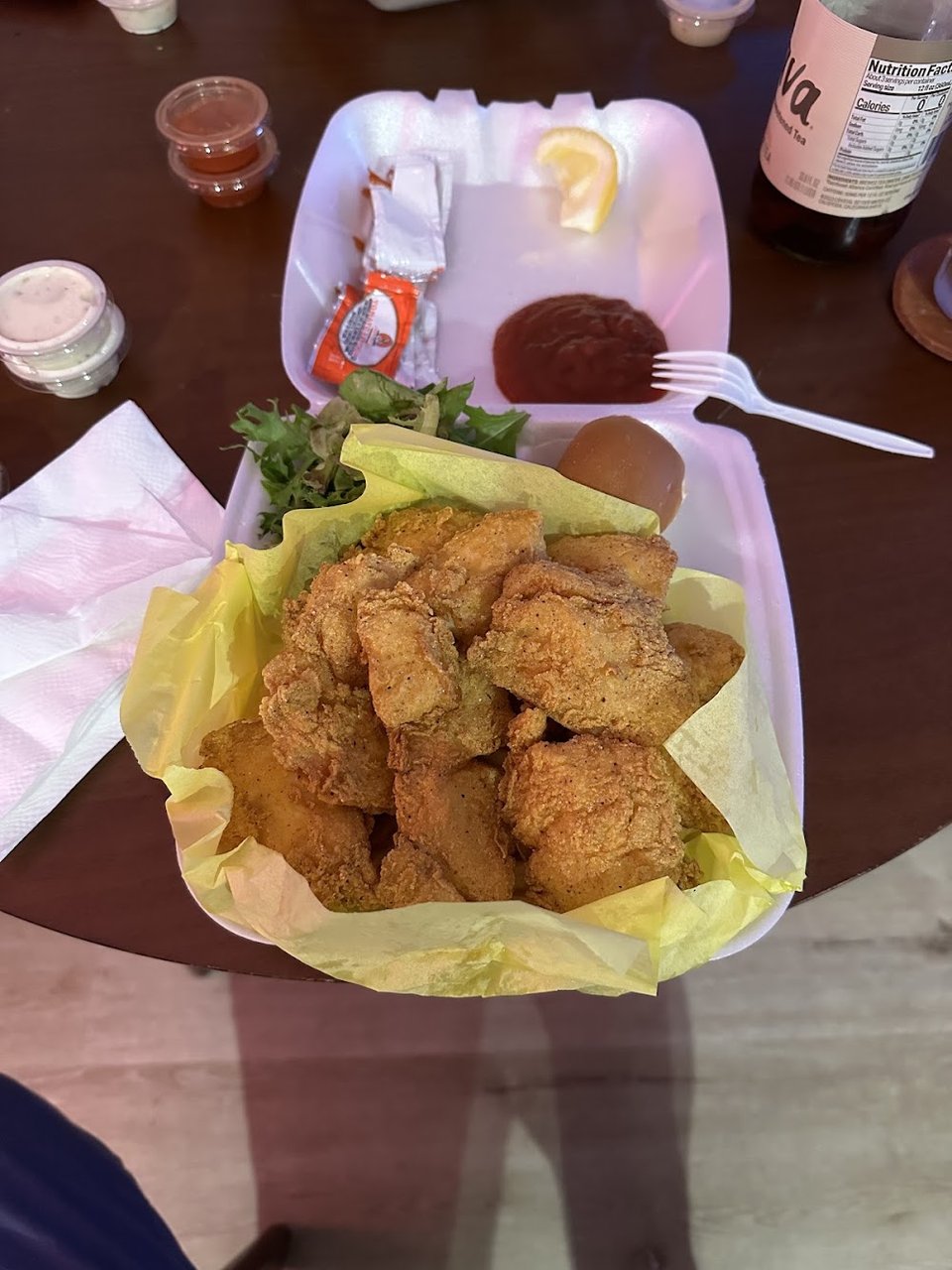 Menu board with fish combos and sides.
