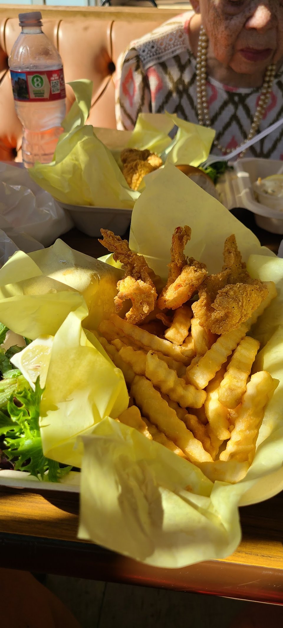 Menu board with fish combos and sides.