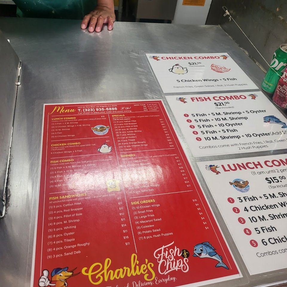 Menu board with fish combos and sides.