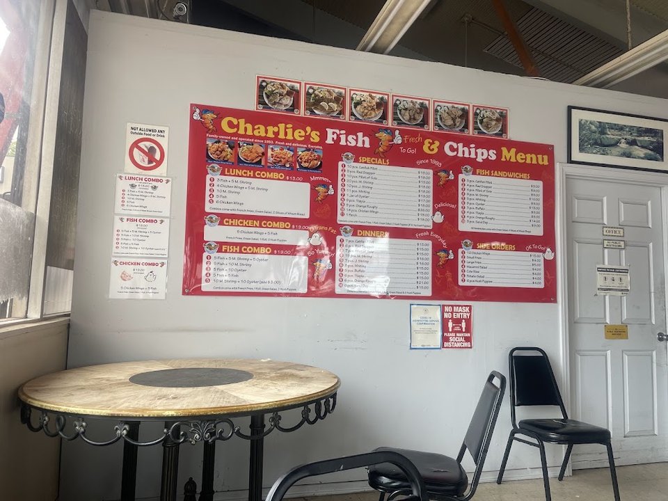 Menu board with fish combos and sides.